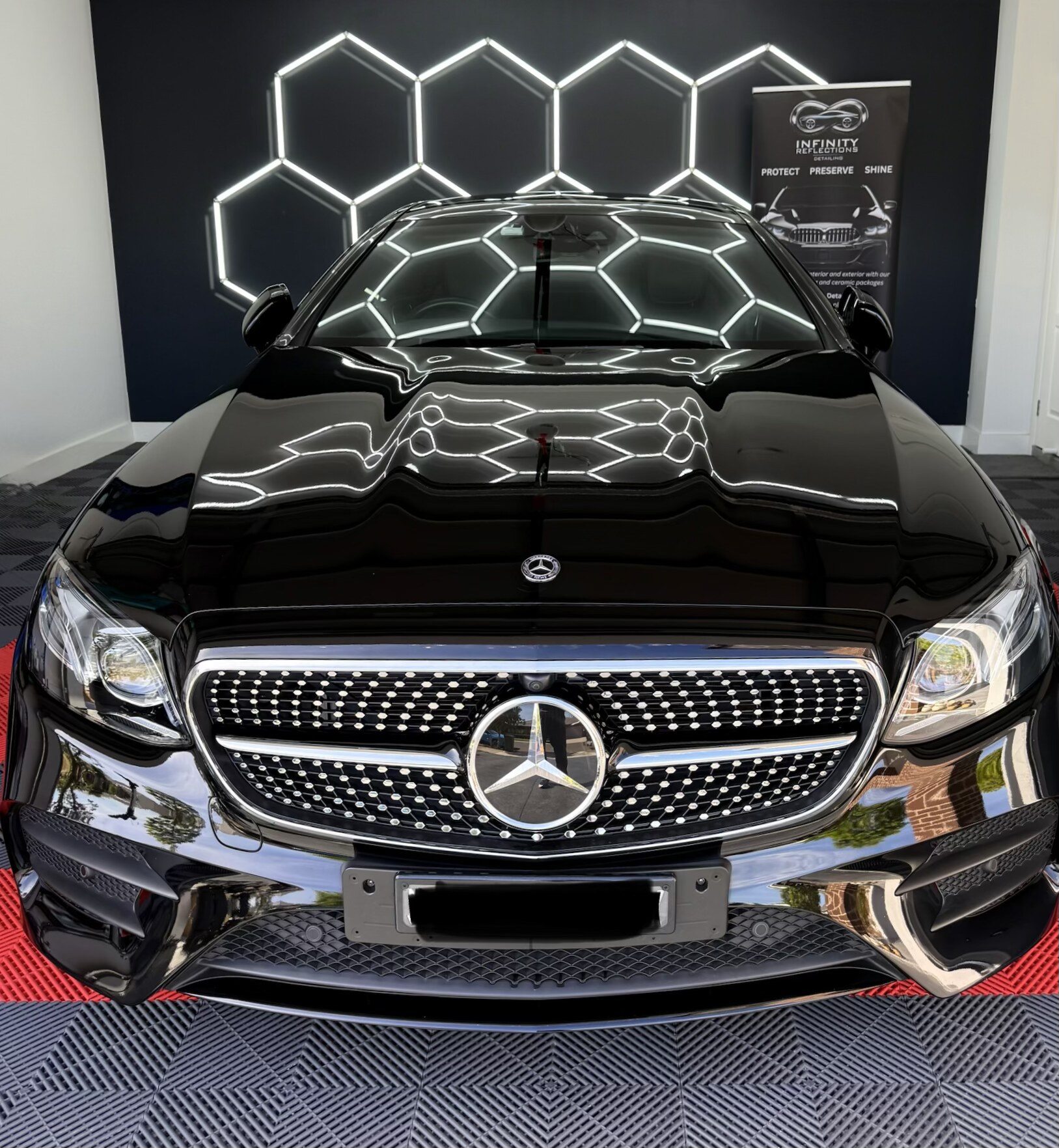 Infinity Reflections lead detailer at work